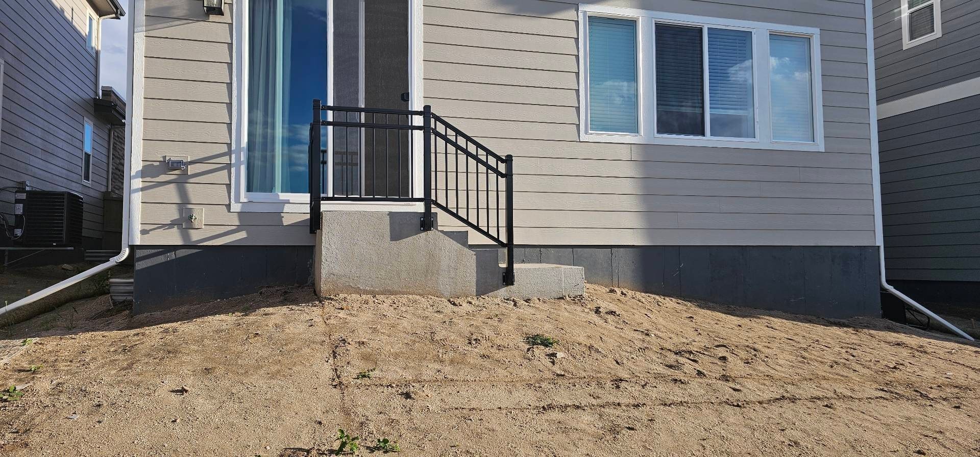 Modern Home Entrance with Masonry Stairs — Yardage Outdoor Living
