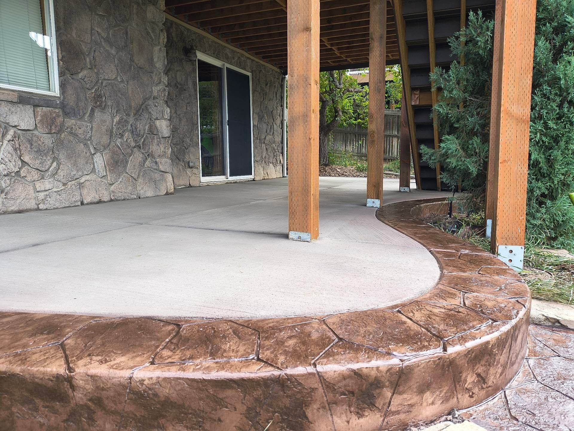 Covered Patio with Stone Walls and Wood Posts — Yardage Outdoor Living