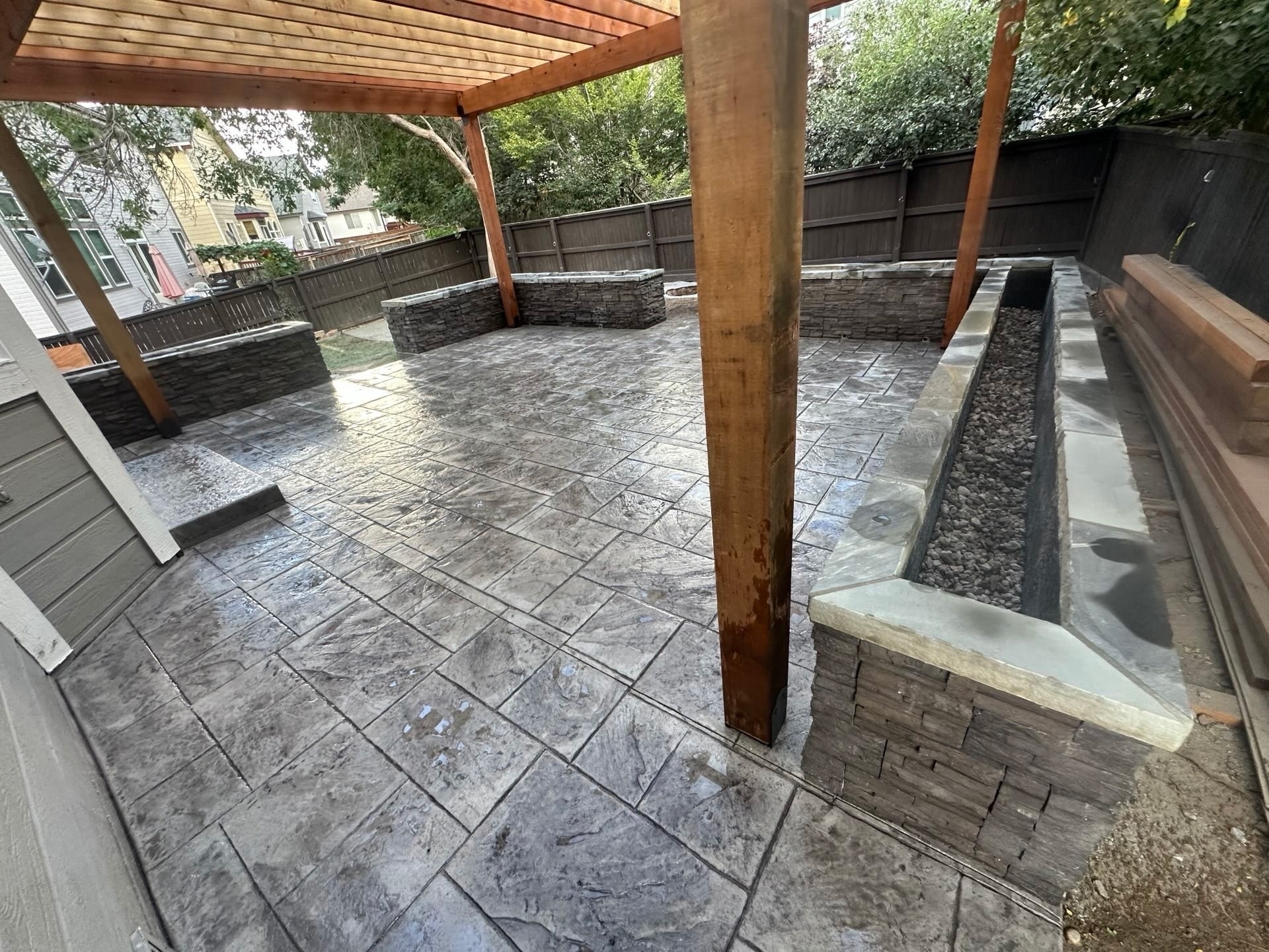 Modern Patio with Pergola and Stone Seating — Yardage Outdoor Living